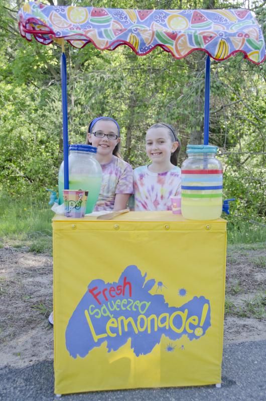 Josephine Eleniefsky and Julia Foie take donations for their lemonade at the race. BY GEORGIA SPARLING